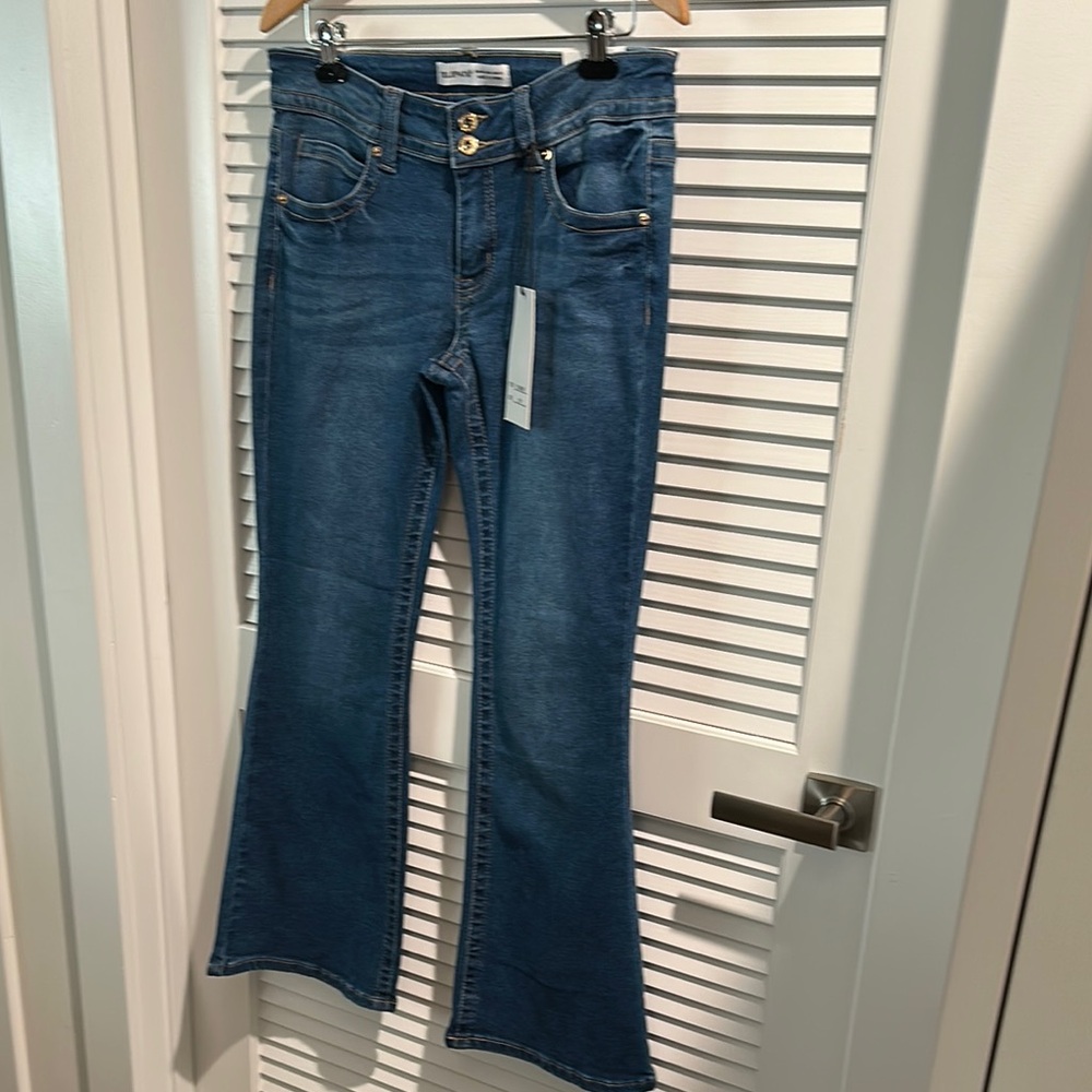 NWT Telepatia Low Rise Boot Cut Stretchy Blue Jeans with Five pockets.